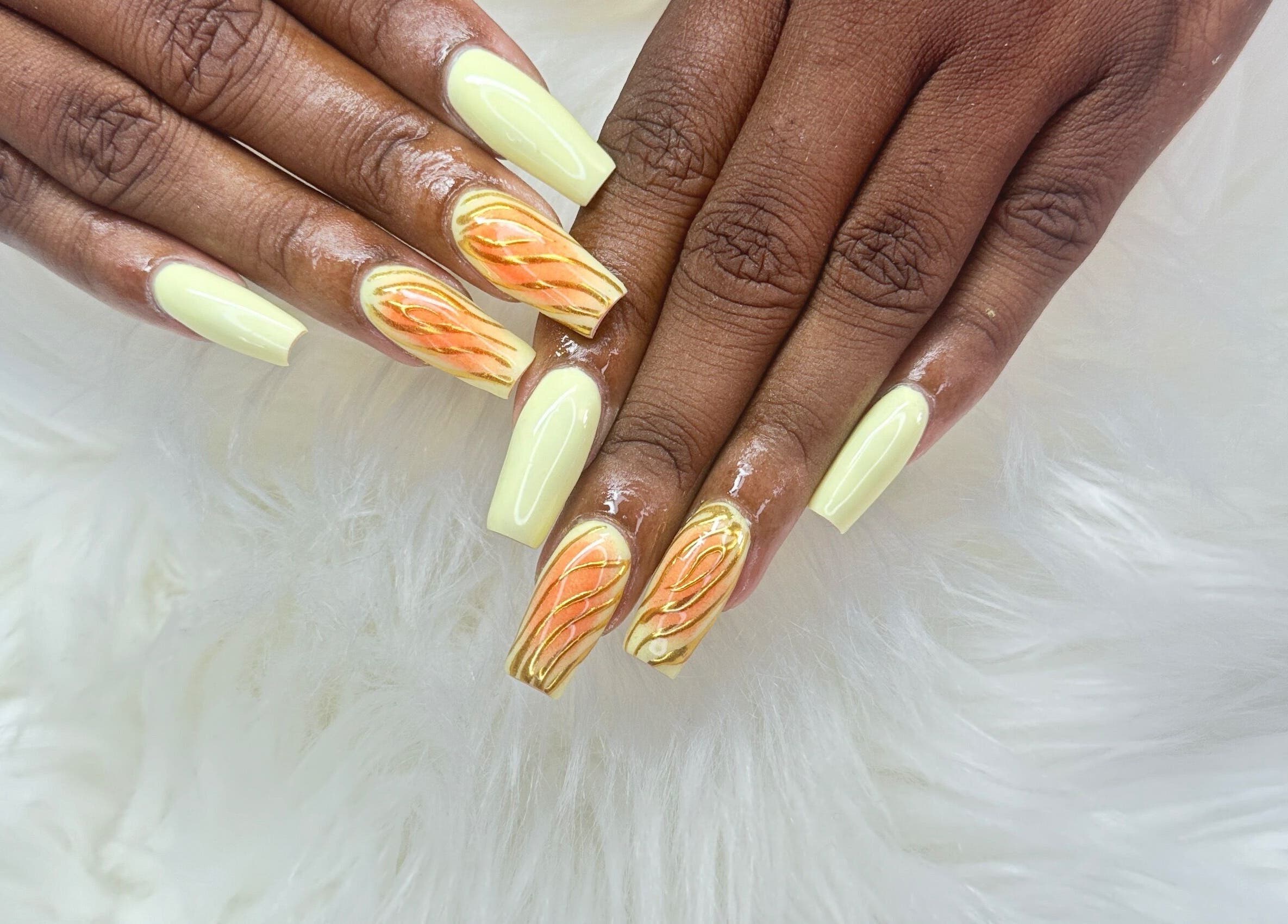 Elegant orange and cream nail art at Zuriah Nails & Cosmetics, Oistins, Christ Church, BB.