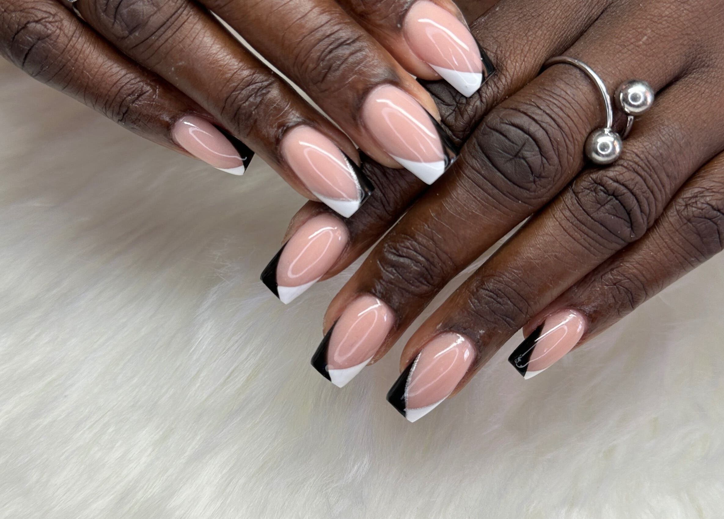 Chic French manicure with black tips at Zuriah Nails & Cosmetics, Oistins, Christ Church, BB.