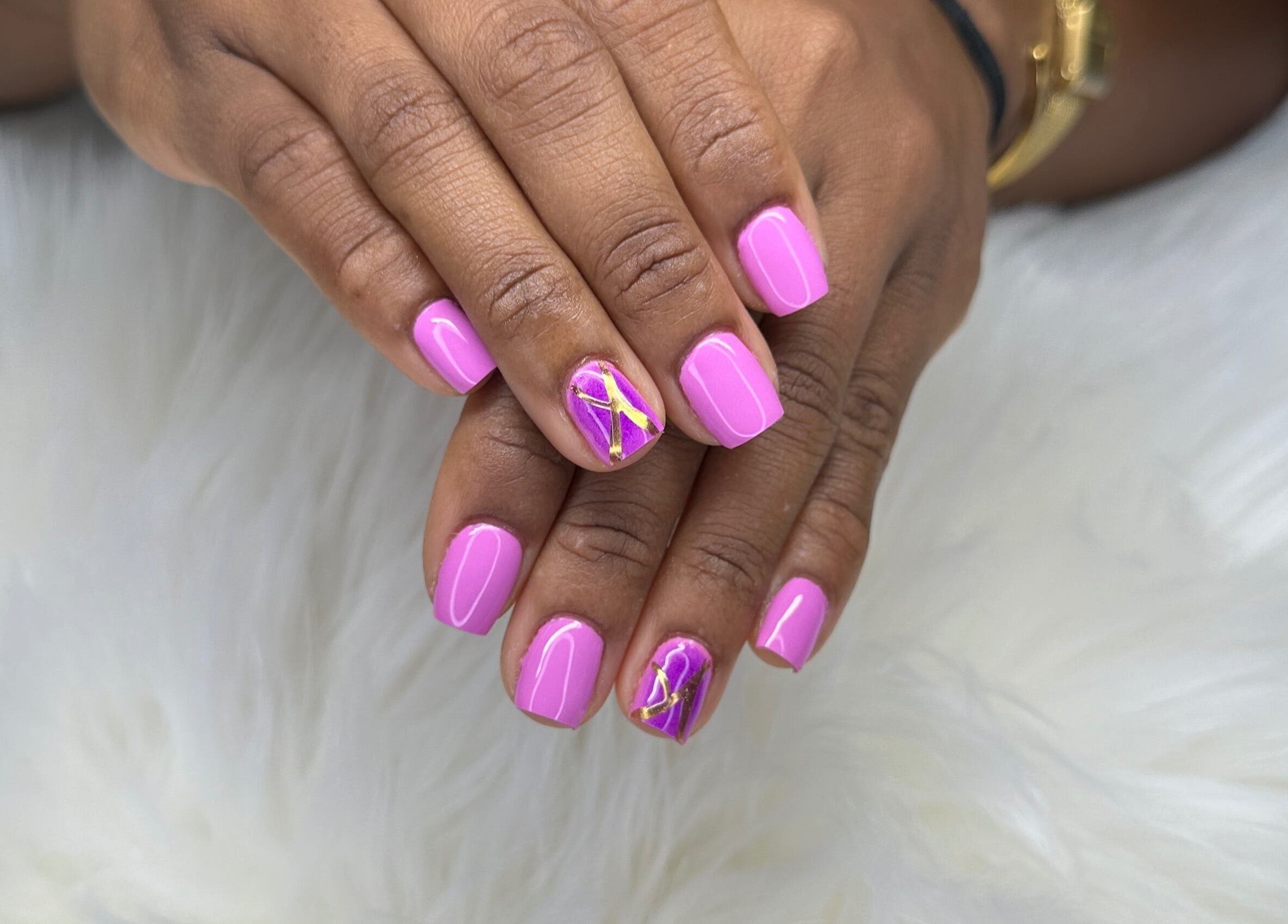 Stylish pink and gold nail art at Zuriah Nails & Cosmetics, Oistins, Christ Church, BB.