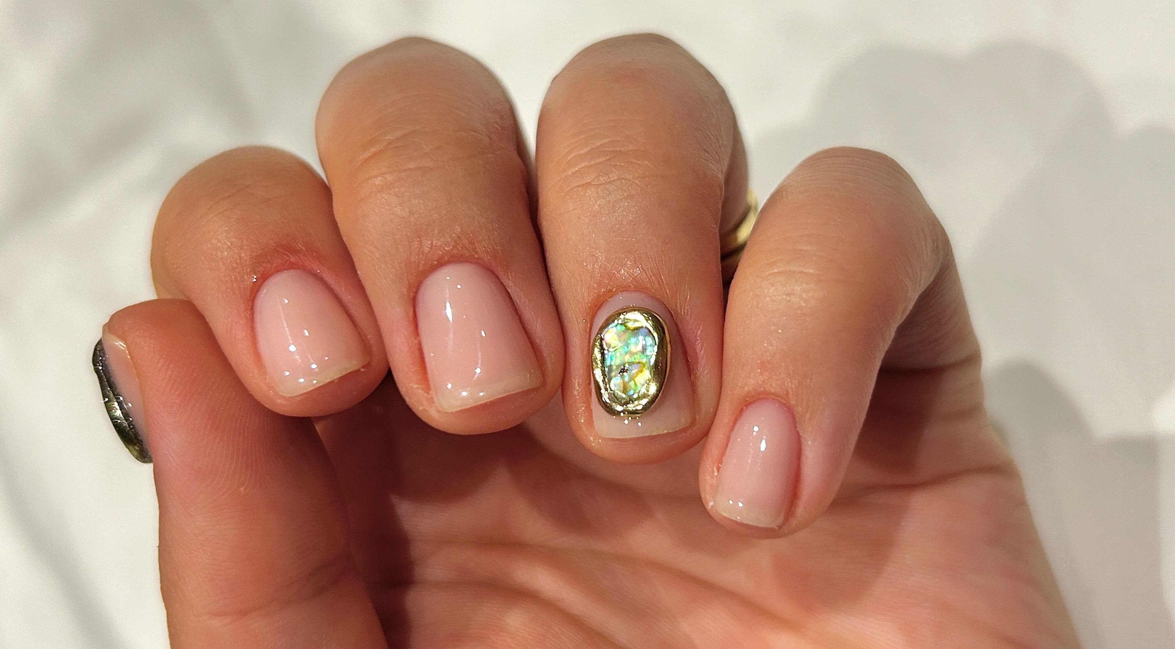 Gleaming manicure with opal gem at Phresh, Woodbridge, England, GB.
