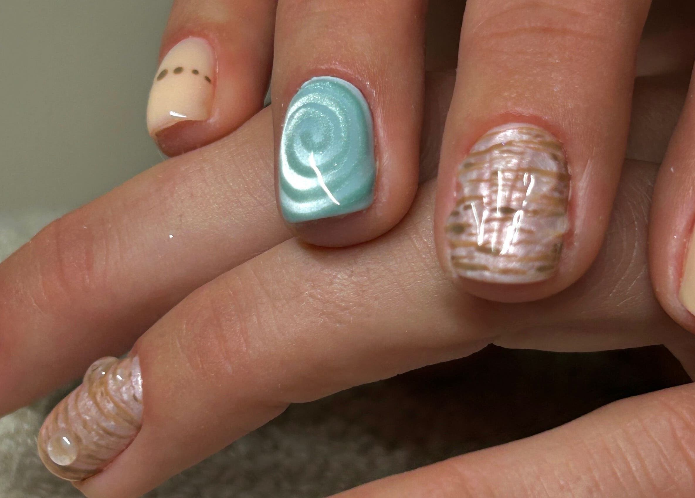 Elegant nail art with intricate designs at Phresh, Woodbridge, England, GB.