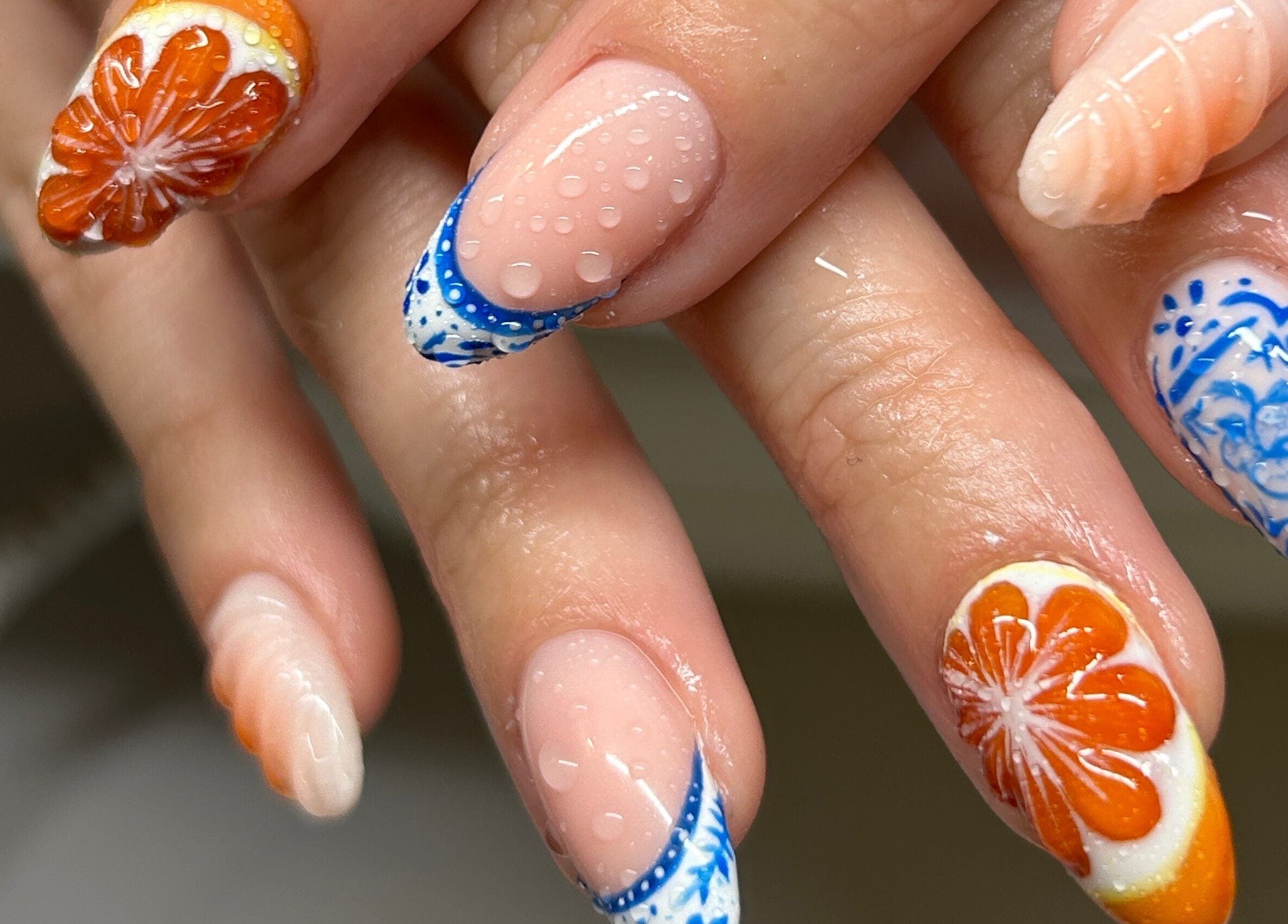 Intricate nail art at Phresh in Woodbridge, England, GB, featuring floral and abstract designs.