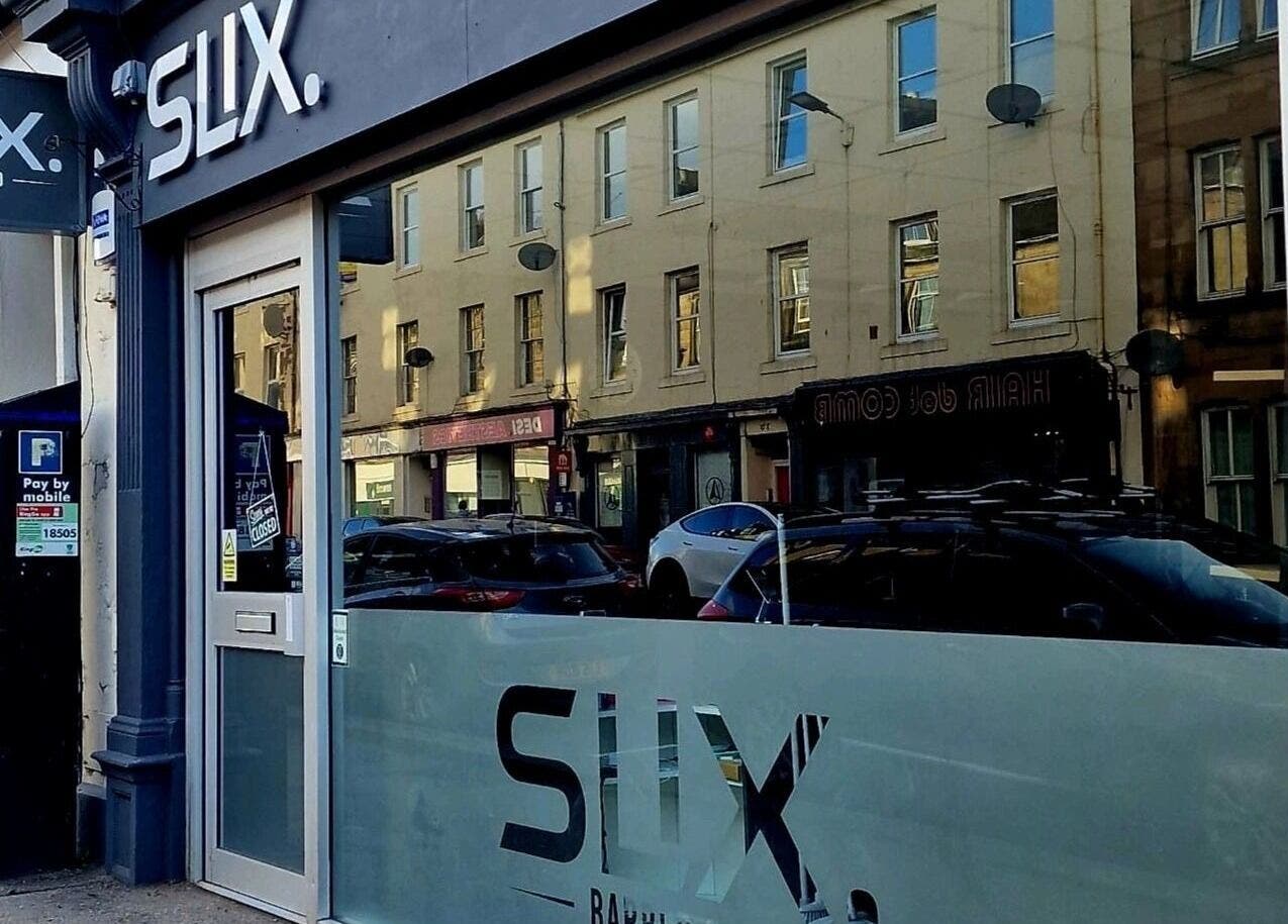 Front entrance of SLIX. Barber Co in Perth, Scotland, GB showcasing modern design and signage.