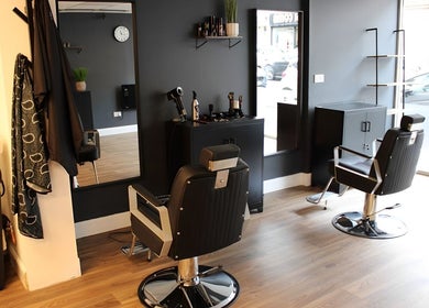 Interior of SLIX. Barber Co, Perth, Scotland, GB with sleek chairs and minimalist decor.