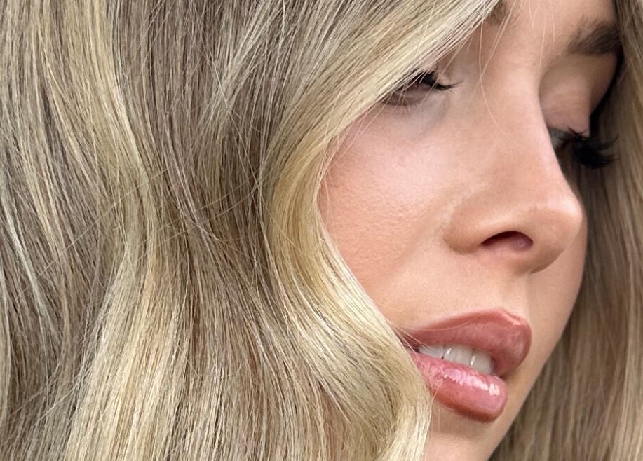 Close-up of blonde hair styled at Hair.ByTayah, Berkeley Vale, New South Wales, AU showcasing soft waves.