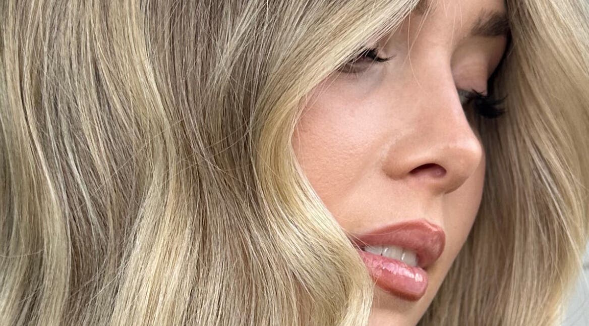 Close-up of blonde hair styled at Hair.ByTayah, Berkeley Vale, New South Wales, AU showcasing soft waves.
