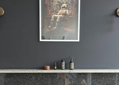 Elegant wall decor at Giuseppe’s of Bath, Bath, England, GB featuring a space-themed art piece and industrial lighting.