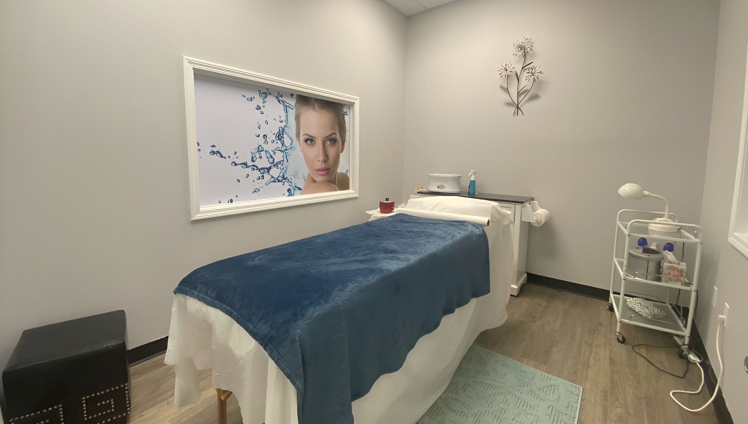 Serene treatment room at Gorgeous Ever Center in Roswell, Georgia, US with a massage table and elegant decor.