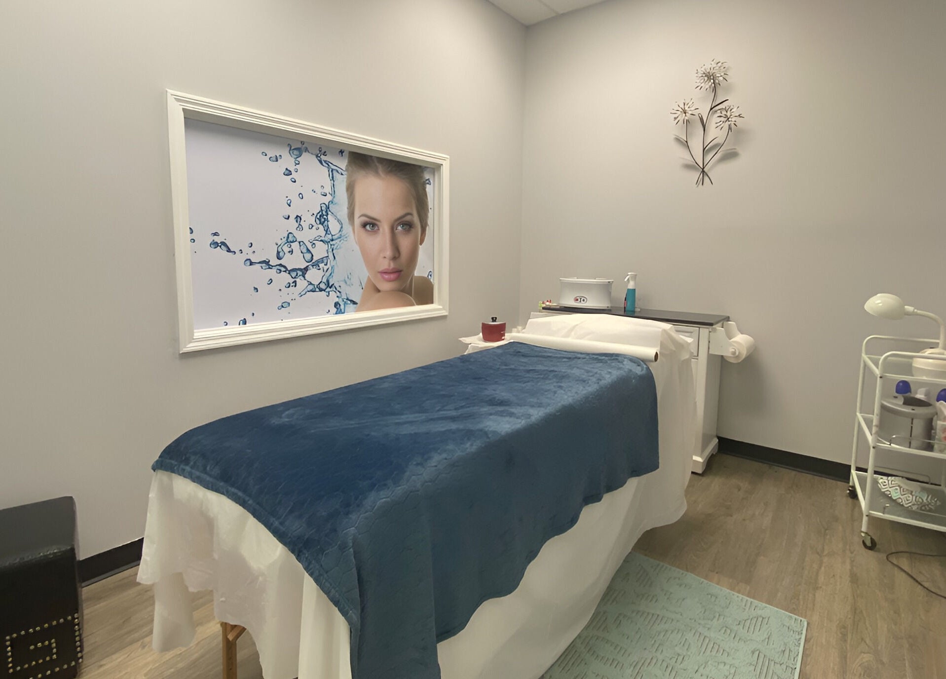 Serene treatment room at Gorgeous Ever Center in Roswell, Georgia, US with a massage table and elegant decor.