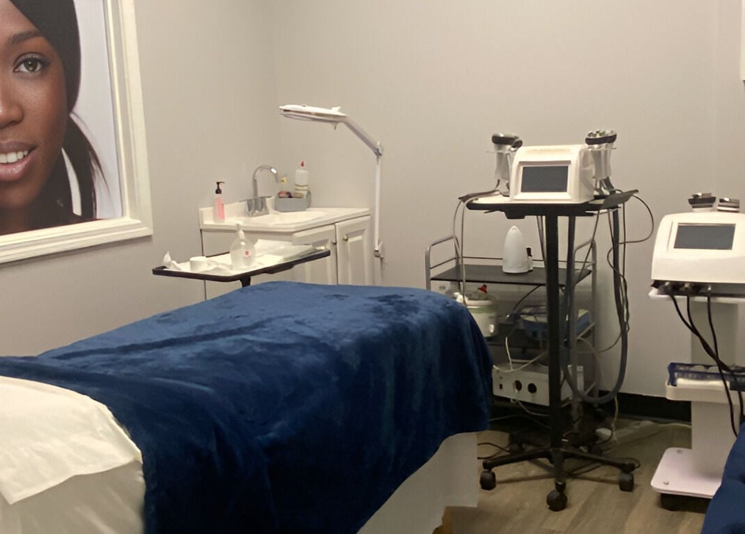 Treatment room at Gorgeous Ever Center, Roswell, Georgia, US with equipment and elegant decor.
