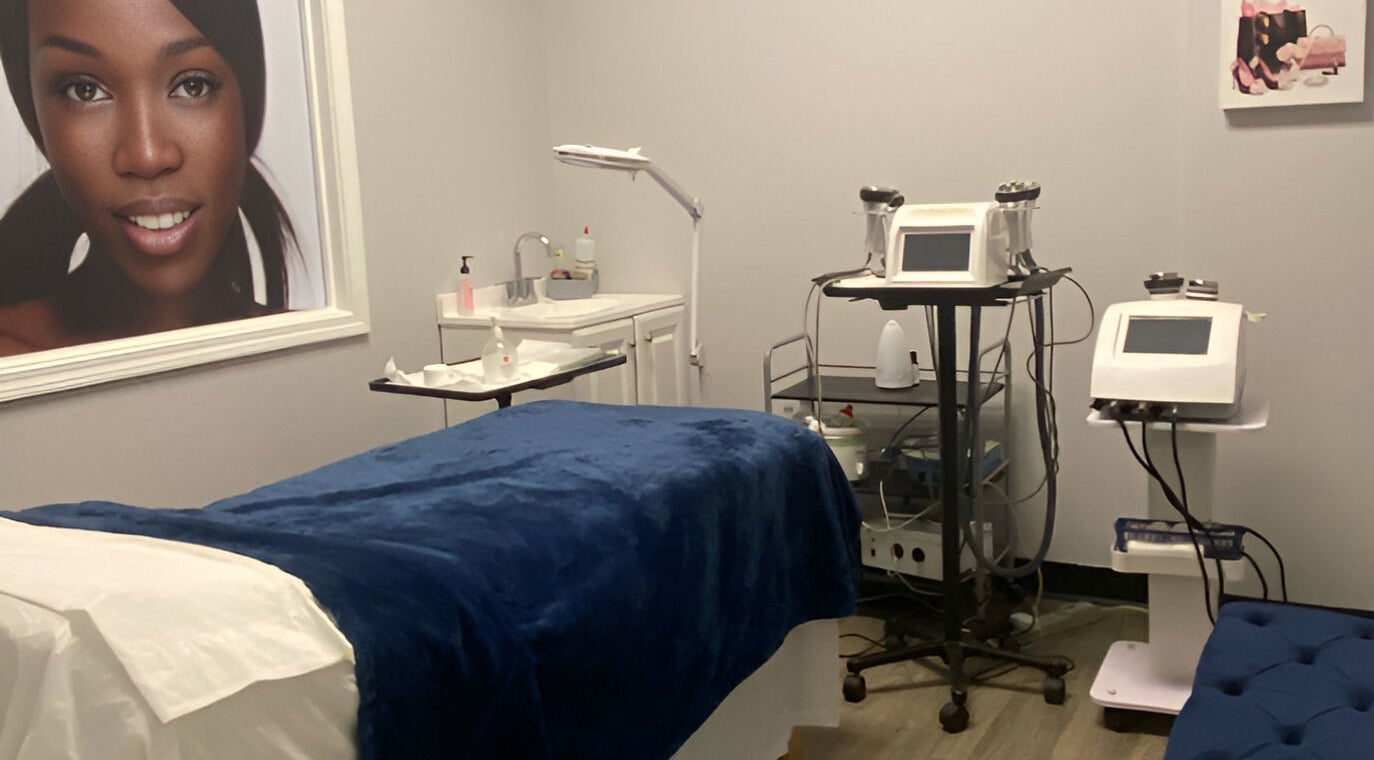 Treatment room at Gorgeous Ever Center, Roswell, Georgia, US with equipment and elegant decor.
