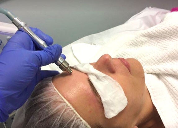 Professional facial treatment at Gorgeous Ever Center in Roswell, Georgia, US. Skin rejuvenation in progress.