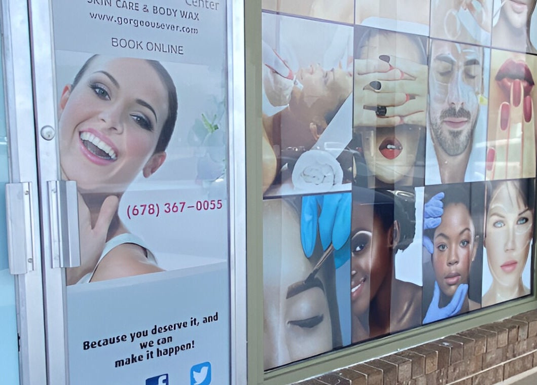 Colorful window display at Gorgeous Ever Center in Roswell, Georgia, US showcasing beauty services.