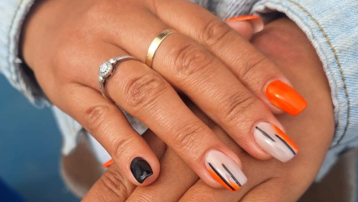 Vibrant nail art in orange and black at The Nail Bar 'By Miche', Worcester, Western Cape, ZA.