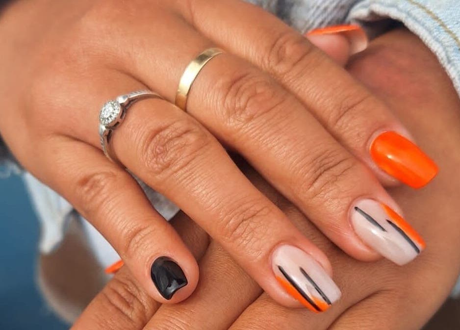 Vibrant nail art in orange and black at The Nail Bar 'By Miche', Worcester, Western Cape, ZA.