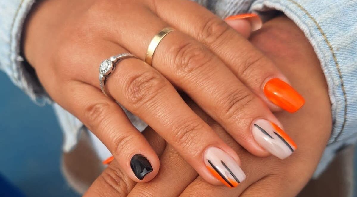 Vibrant nail art in orange and black at The Nail Bar 'By Miche', Worcester, Western Cape, ZA.