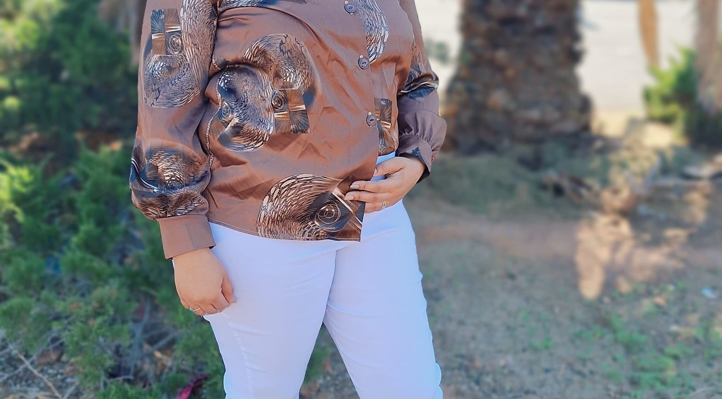 Person in elegant blouse visiting The Nail Bar 'By Miche', Worcester, Western Cape, ZA.