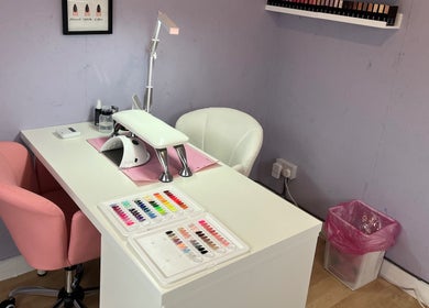 Stylish nail workstation at NextLevelNails, Northleach, England, GB offering vibrant polish choices.