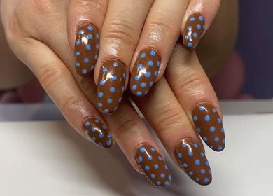 Brown nails with blue polka dots manicure at NextLevelNails, Northleach, England, GB.