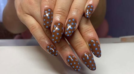 Brown nails with blue polka dots manicure at NextLevelNails, Northleach, England, GB.