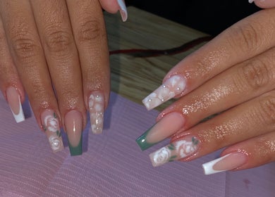 Intricate floral nail art at AllurebeautybyC_ in Cape Town, Western Cape, ZA. Unique design with green and white accents.