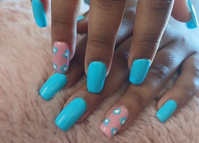 Stylish blue nails with floral design at X Nails and Beauty, Ballito, Kwazulu-natal, ZA.