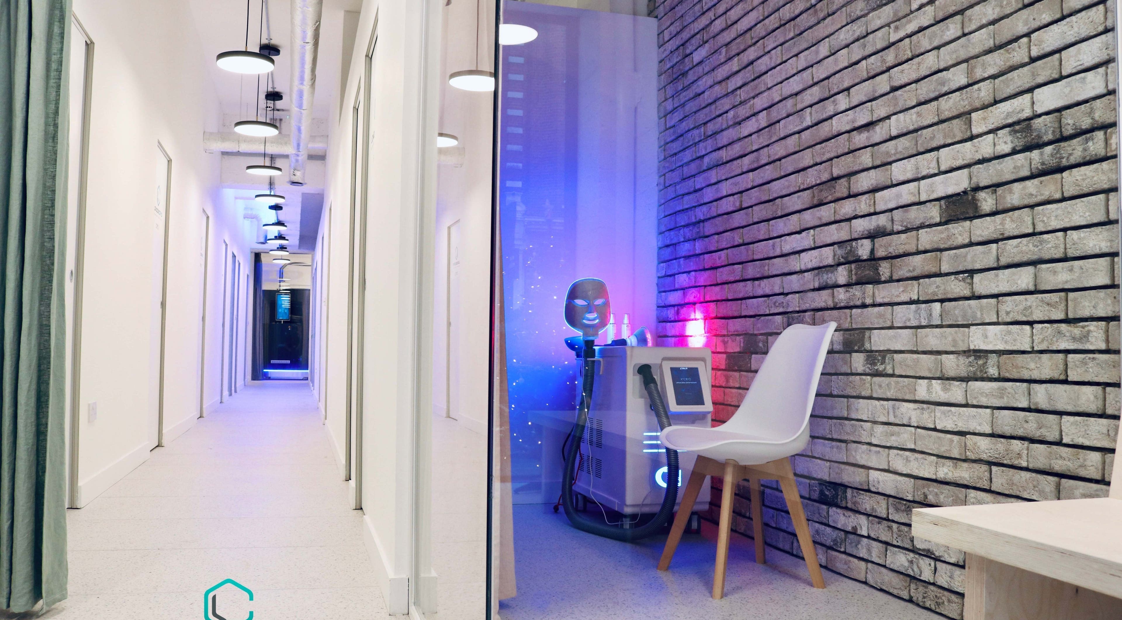 Sleek interior of LondonCryo St Johns Wood, London, England with cryotherapy equipment and modern decor.
