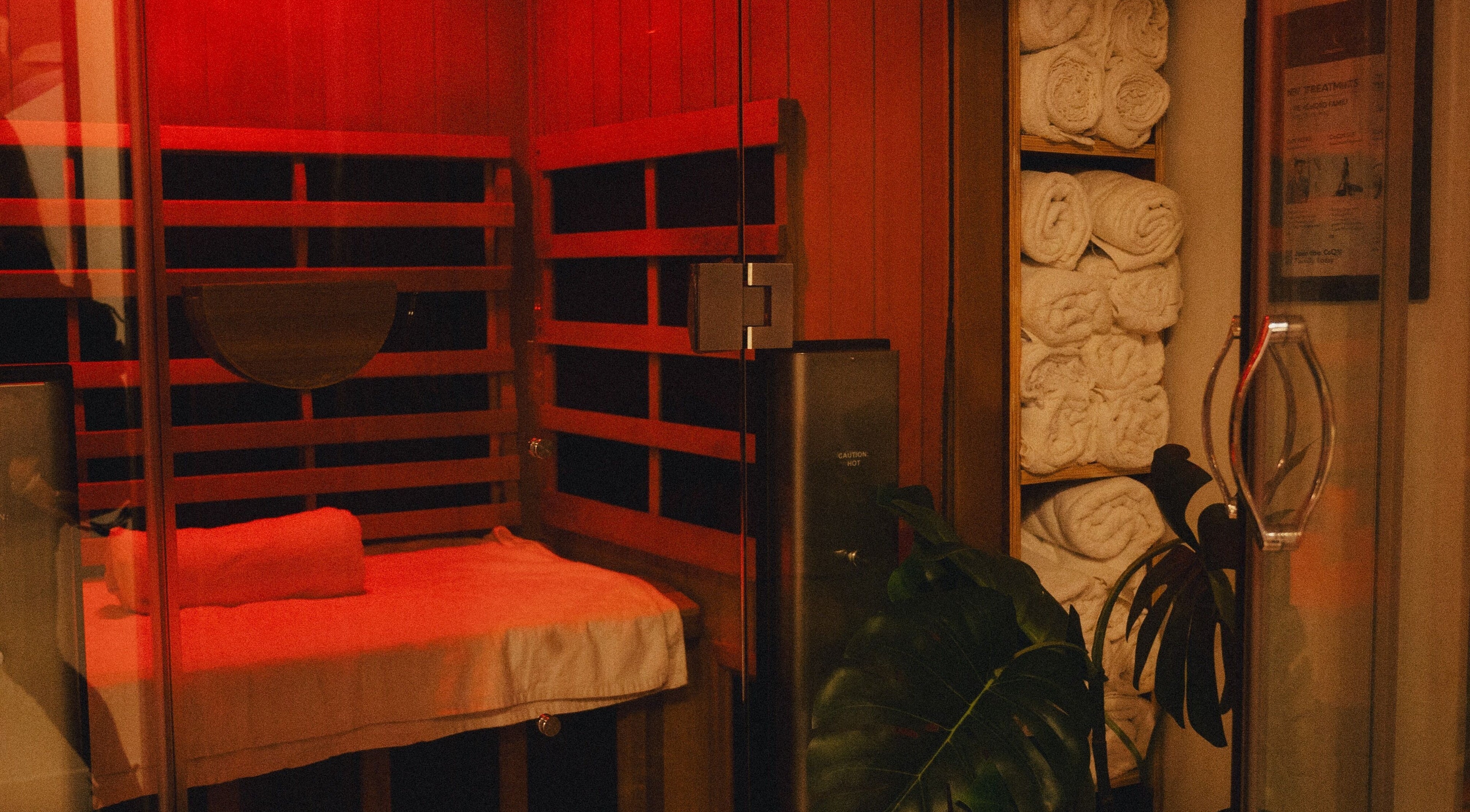 Elegant sauna room at LondonCryo, London, England, GB, with plush towels and warm lighting.