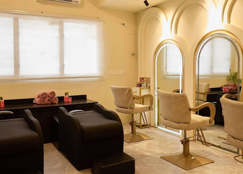Interior of CBK Beauty Flagship Salon in Accra, Greater Accra Region, GH with styling chairs and mirrors.