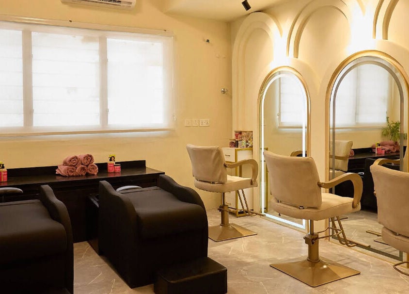 Interior of CBK Beauty Flagship Salon in Accra, Greater Accra Region, GH with styling chairs and mirrors.