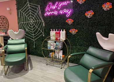 Stylish interior of Megan Eve Hair in Hinckley, England, GB showcasing vibrant decor and comfortable seating.