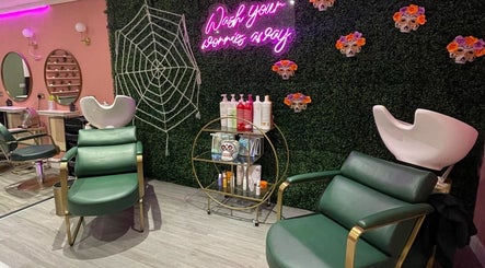 Stylish interior of Megan Eve Hair in Hinckley, England, GB showcasing vibrant decor and comfortable seating.