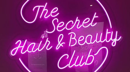 Vibrant neon sign at Megan Eve Hair, Hinckley, England, GB, showcasing beauty club allure.