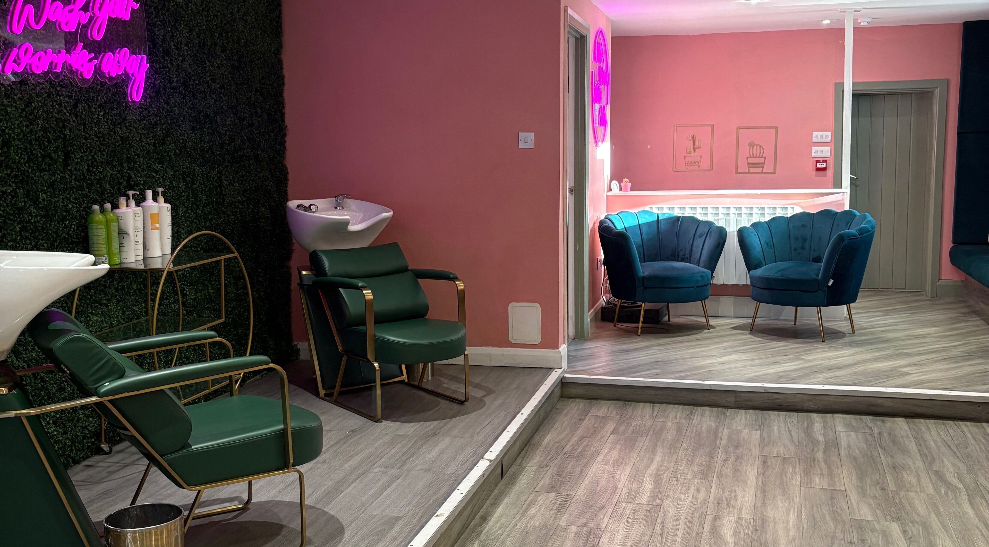 Modern interior of Megan Eve Hair in Hinckley, England with stylish seating and wash stations.