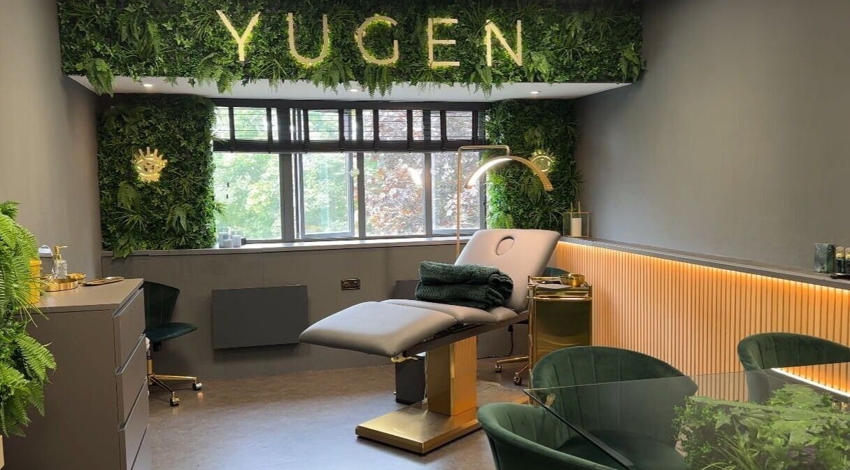 Yugen Skin Clinic in Sandbach, England features a tranquil treatment room with lush greenery and modern decor.