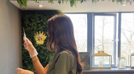 Aesthetician prepares a treatment in the lush interior of Yugen Skin Clinic, Sandbach, England, GB.