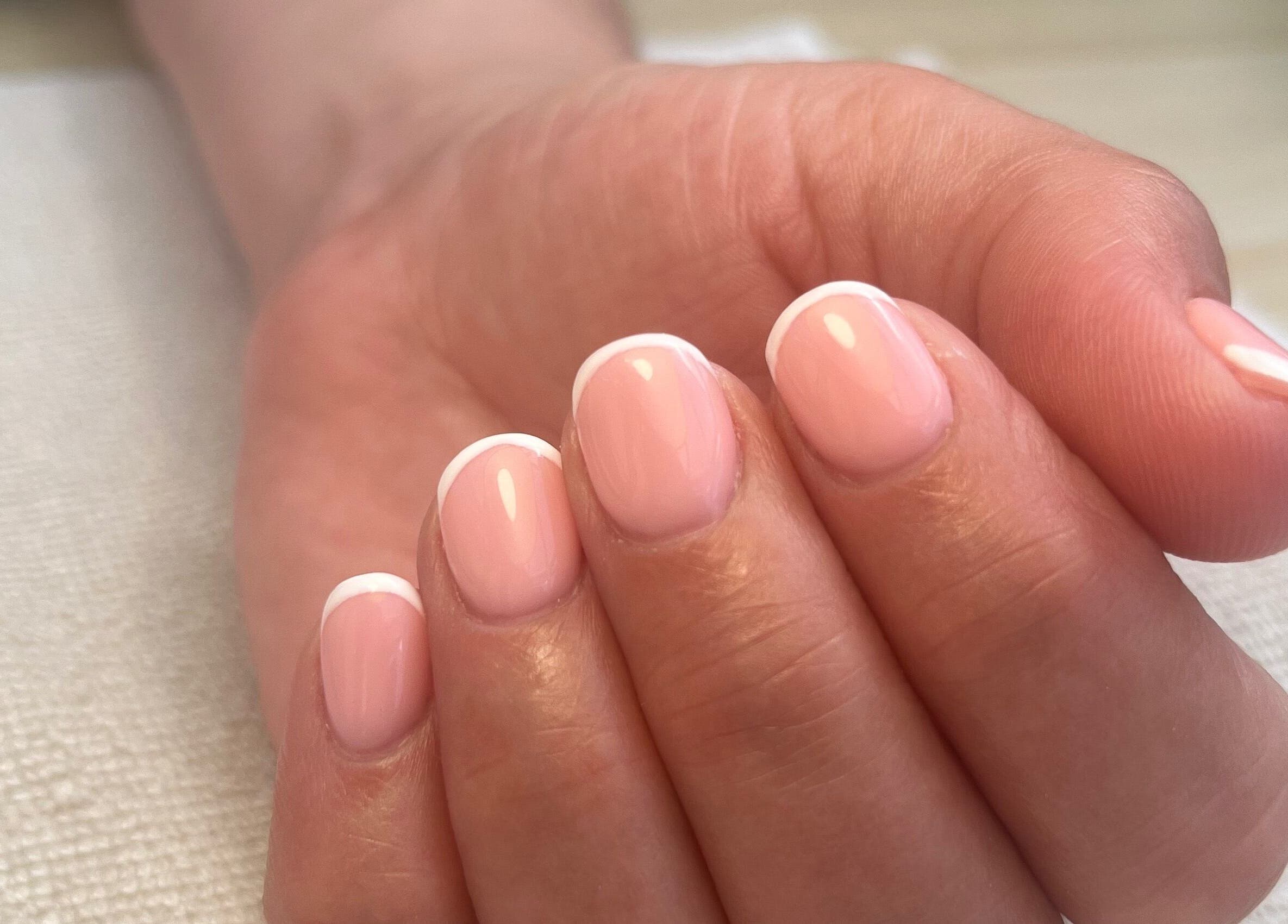 Elegant French manicure at Polished by Megan, Ashington, England, GB, showcasing delicate pink and white nails.