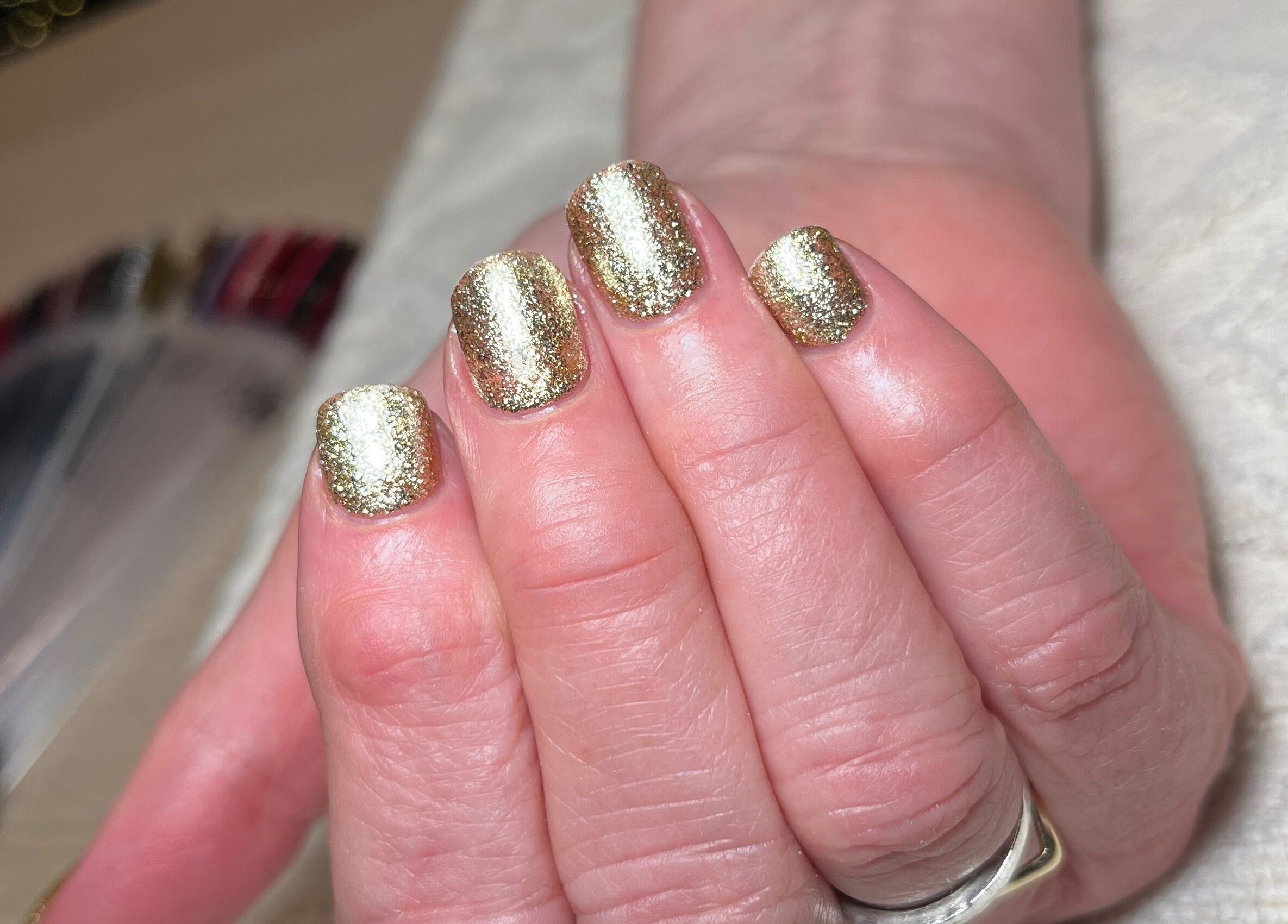 Shimmering gold nails at Polished by Megan, Ashington, England, GB.