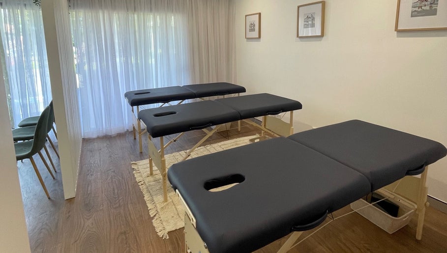 Therapy room featuring massage tables at Your Healing Hub & Abiding Body Wellness, Helensvale, Queensland, AU.