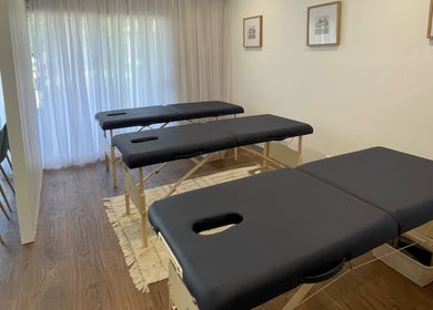 Therapy room featuring massage tables at Your Healing Hub & Abiding Body Wellness, Helensvale, Queensland, AU.