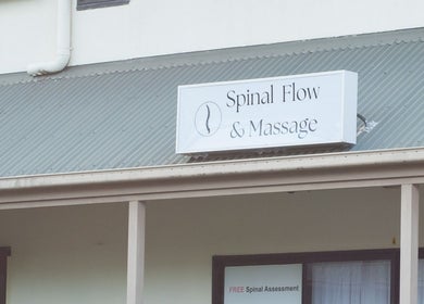 Signage for 'Spinal Flow & Massage' at Your Healing Hub & Abiding Body Wellness, Helensvale, Queensland, AU.