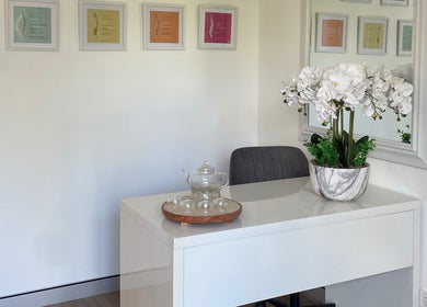 Calming reception at Your Healing Hub & Abiding Body Wellness, Helensvale, Queensland, AU with orchids and tea set.