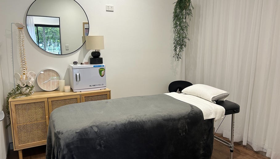 Relaxation room at Your Healing Hub & Abiding Body Wellness, Helensvale, Queensland, AU with a massage table.
