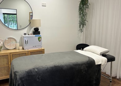 Relaxation room at Your Healing Hub & Abiding Body Wellness, Helensvale, Queensland, AU with a massage table.