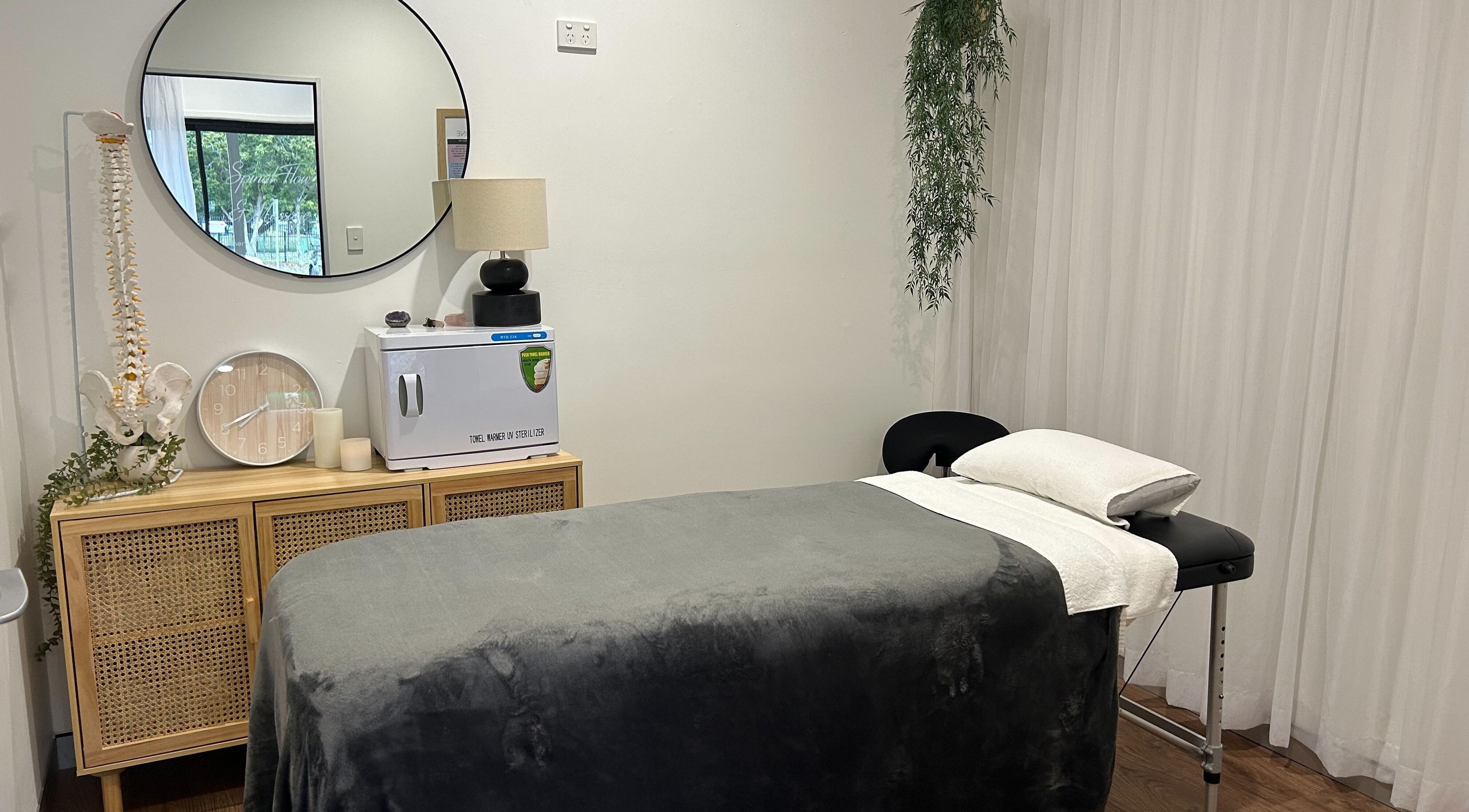 Tranquil treatment room at Your Healing Hub & Abiding Body Wellness, Helensvale, Queensland, AU, featuring a massage table.