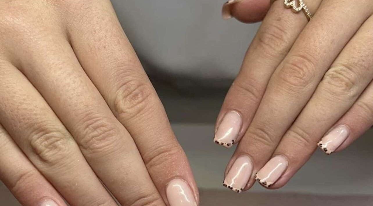 Elegant manicured hands with a delicate nail design at Nails by Sophie Coleman, Elland, England, GB.