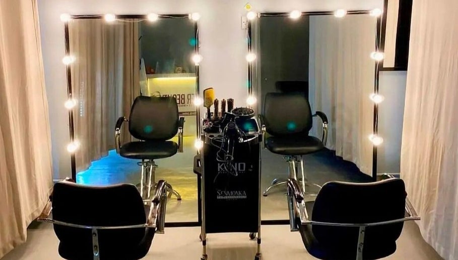Sister Beauty Saloon's well-lit styling area with elegant chairs in Mukah, Sarawak, MY.