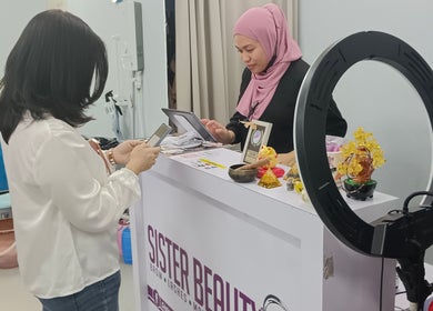 A customer being warmly greeted at Sister Beauty Saloon, Mukah, Sarawak, MY reception area.