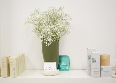 Shelf with beauty products and flowers at Parlour Box, North Bondi, New South Wales, AU.