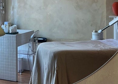 Cozy treatment room at Parlour Box, Bondi, New South Wales, AU, featuring a massage table and soft lighting.